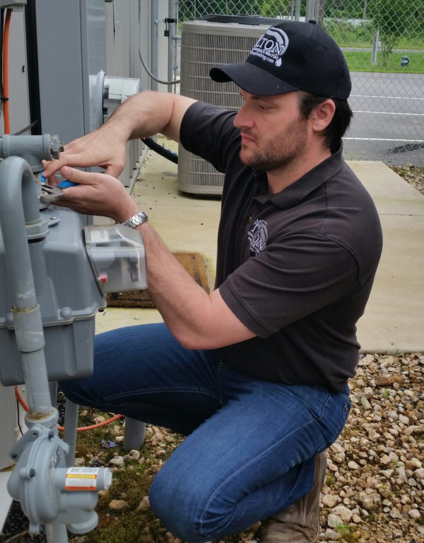 Plumber Mike Tilton testing a gas meter
